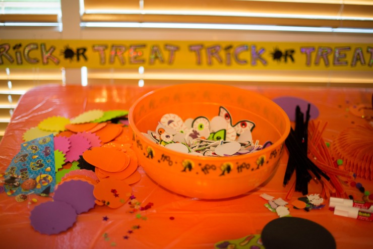 A Halloween party setup with confetti and banners.