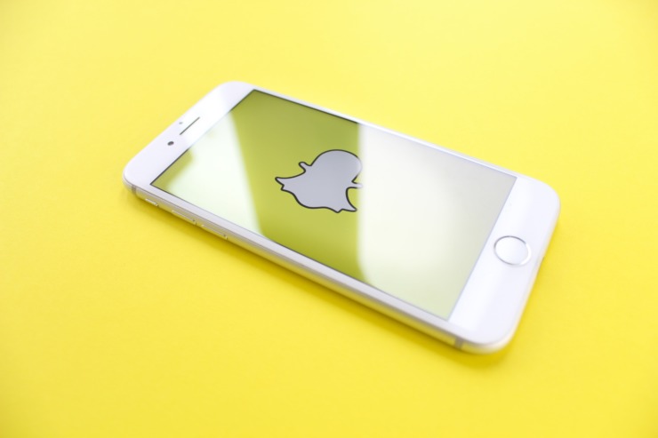 A snapchat ghost on a yellow background