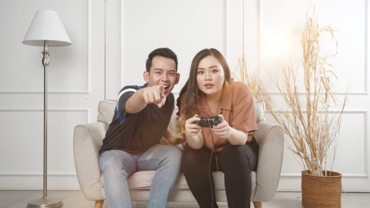 Gen Z gamers enjoy a console game together