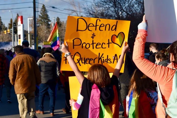 A Gen Z protestor marches for LGBTQ+ rights