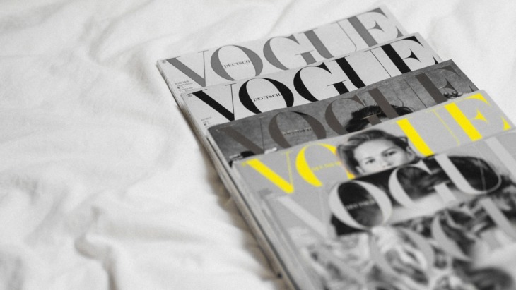 Vogue magazines stacked neatly together