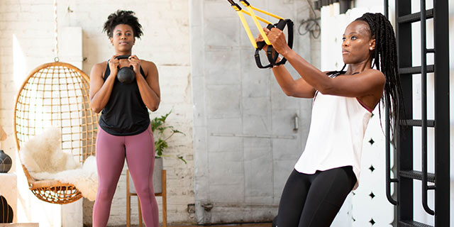 Two woman working out - TRX Training ad