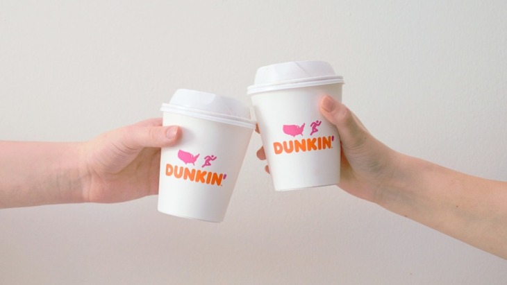 two Dunkin' Donuts coffee cups