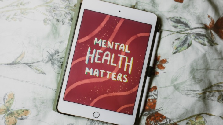Ipad with a illustration that reads 'mental health matters'