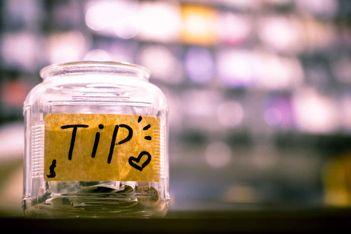 Tip jar containing money