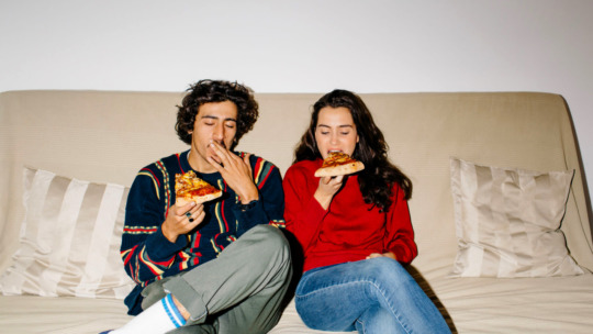 Couple Enjoying Pizza