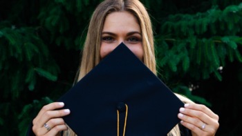 Student holding their graduation cap