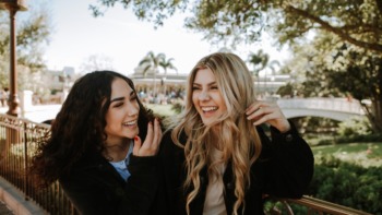 two friends laughing together