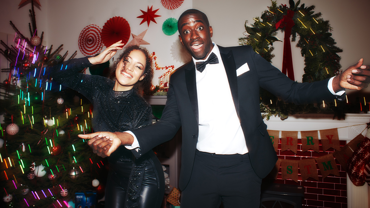 Two young people dressed in party clothes 