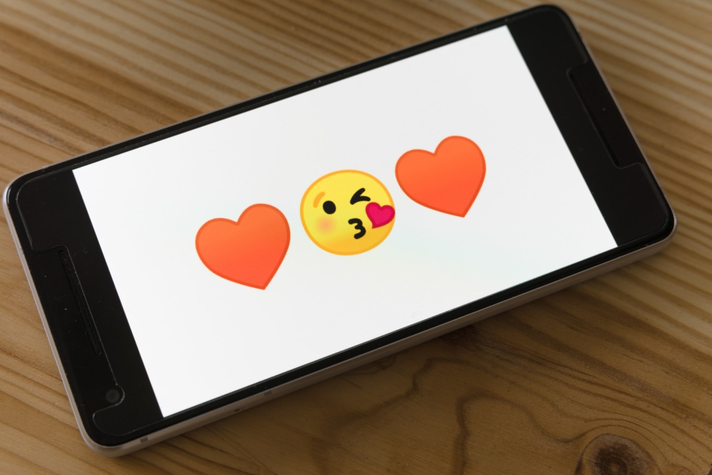 phone screen featuring love heart emojis