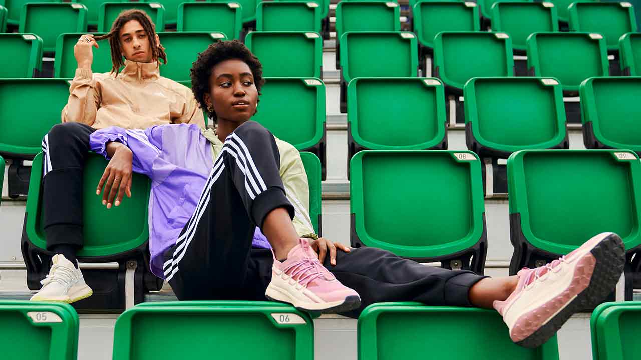 Young people pose in Adidas outfits