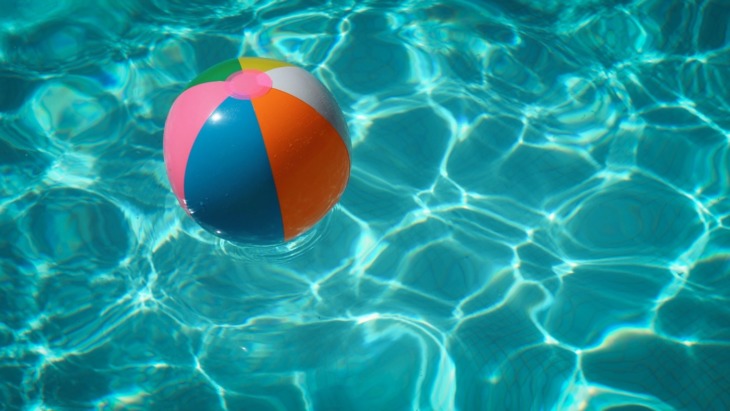Swimming pool with a beach ball in it
