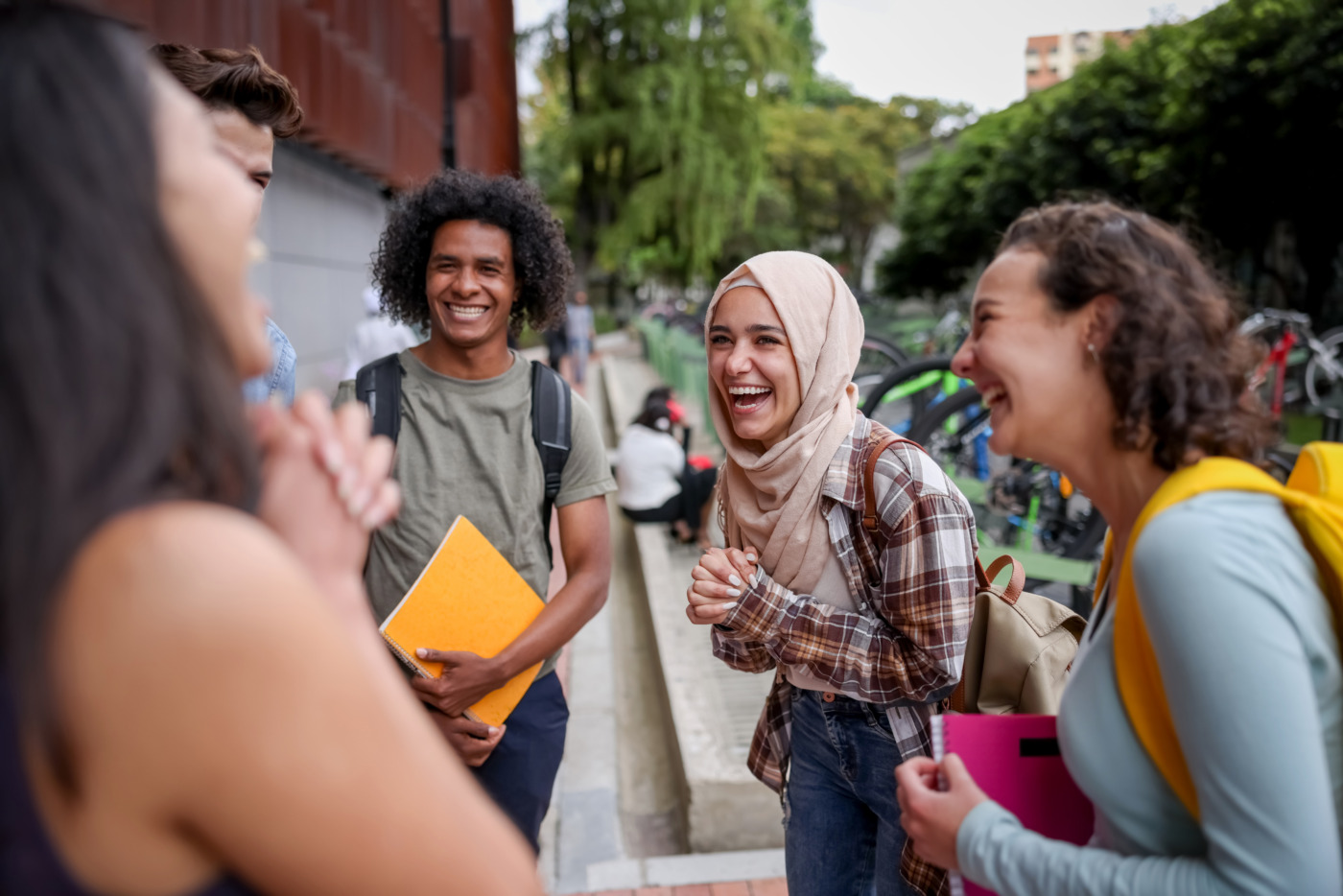 Gen Z students looking very happy talking at the school and laughing
